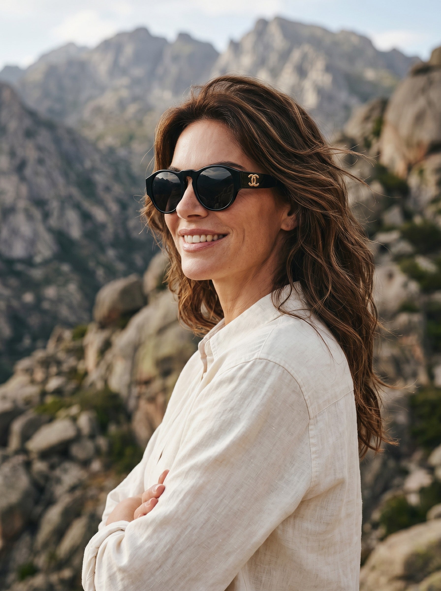 Curated Closet vintage black acetate Chanel sunglasses with gold CC logos and dark lenses.